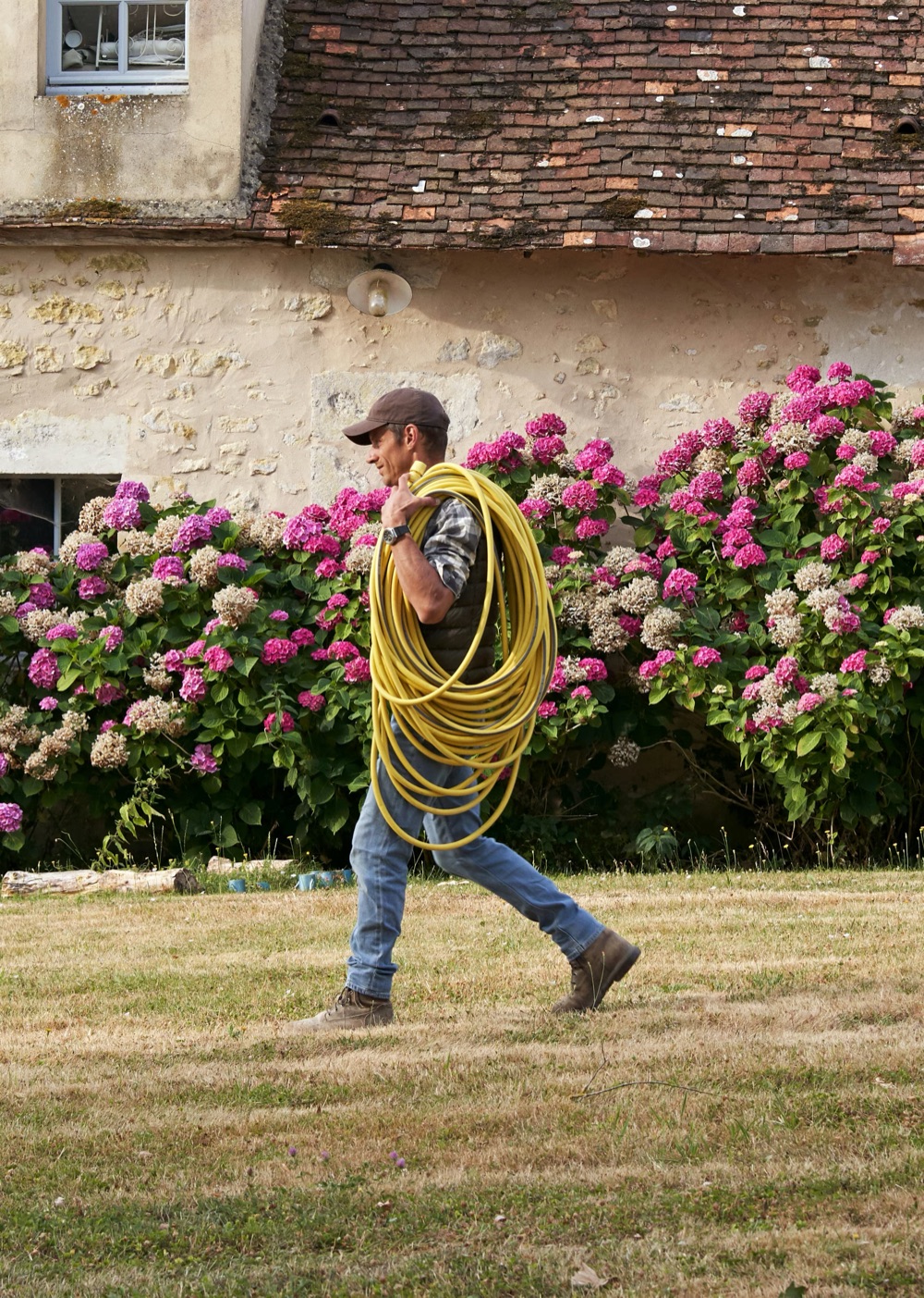 The Le Concierge du Perche caretaker tending a garden